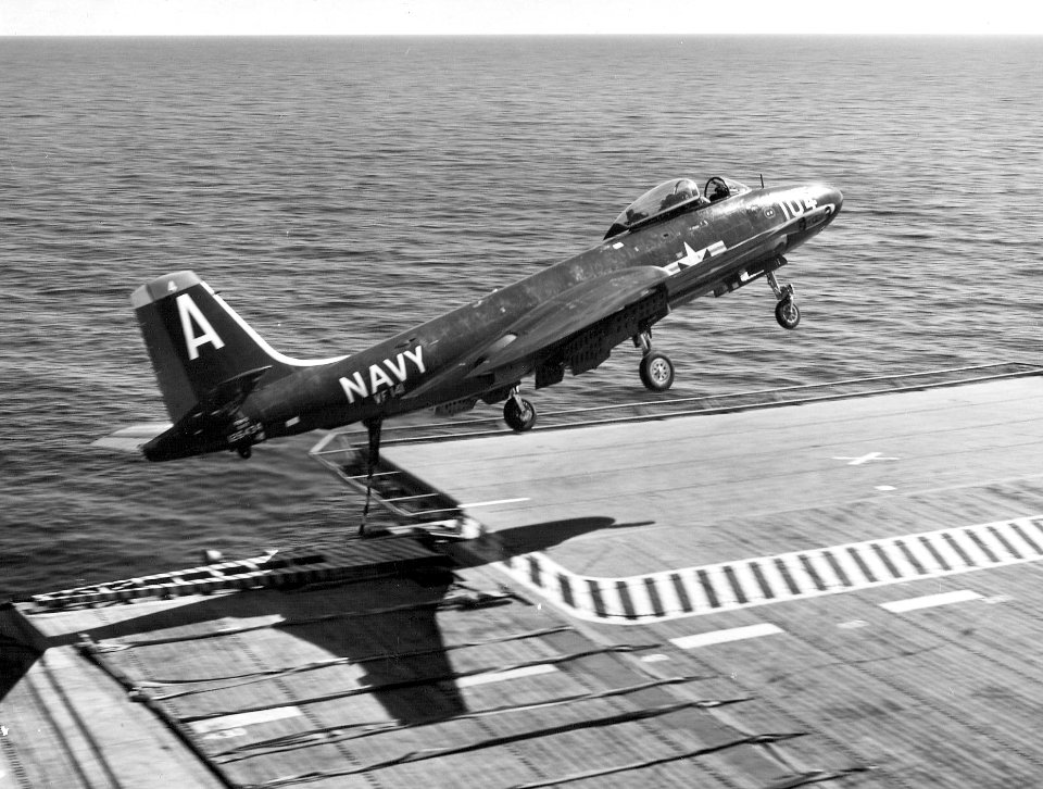 F2H-3 of VF-141 over flight deck of USS Randolph (CVA-15) 1954
