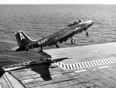 F2H-3 of VF-141 over flight deck of USS Randolph (CVA-15) 1954