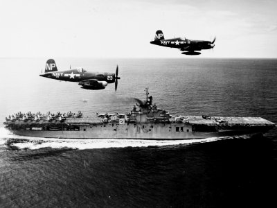 F4U-5N Corsairs of VC-3 fly past USS Boxer (CV-21) off Korea on 4 September 1951 (80-G-433005)
