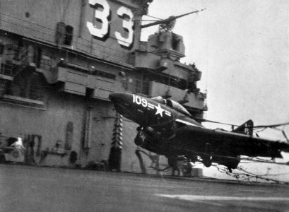 F9F-8 Cougar of VF-91 hits crash barrier on USS Kearsarge (CVA-33) c1956