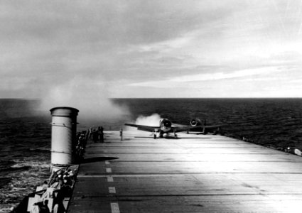 F6F making rocket assisted takeoff from USS Altamaha (CVE-18) 1944