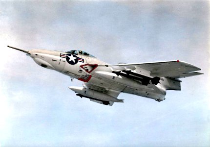 F8F-8 Cougar with Sidewinder missiles in flight 1958
