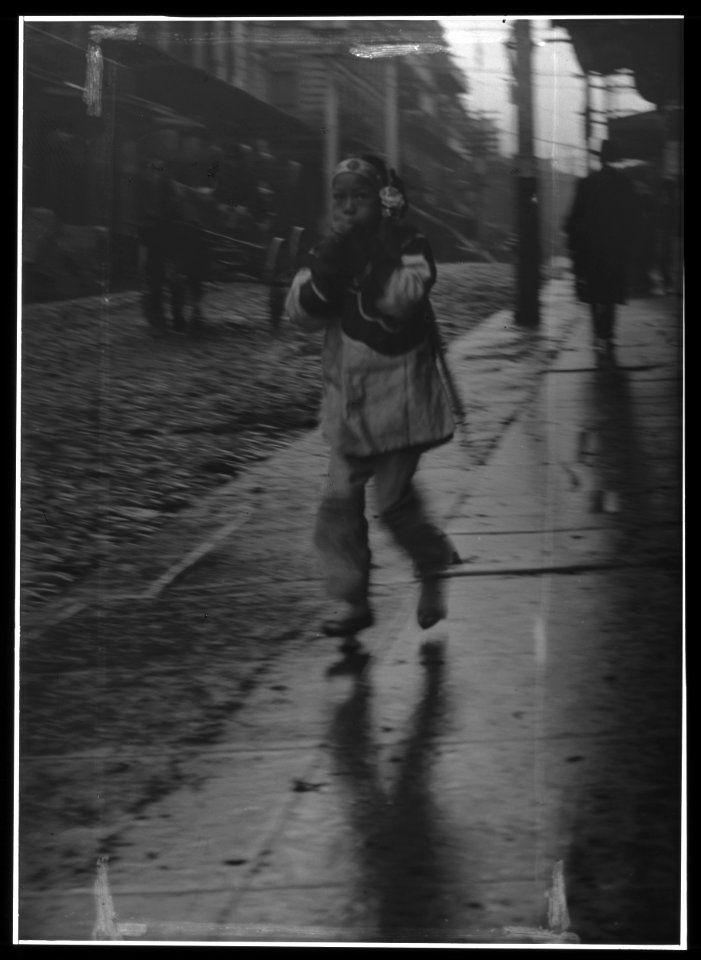 Girl running down a street, Chinatown, San Francisco LOC agc.7a55020