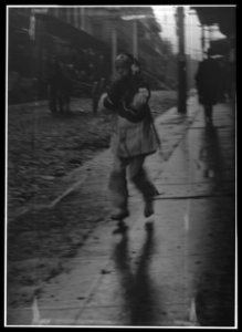 Girl running down a street, Chinatown, San Francisco LOC agc.7a55020