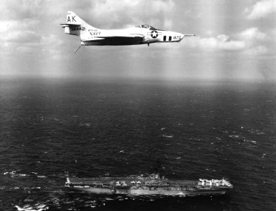 F9F-8P of VFP-62 over USS Essex (CVA-9) in 1960