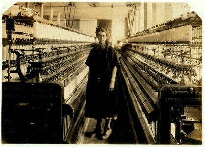 Girl standing in spinning room. LOC nclc.03056