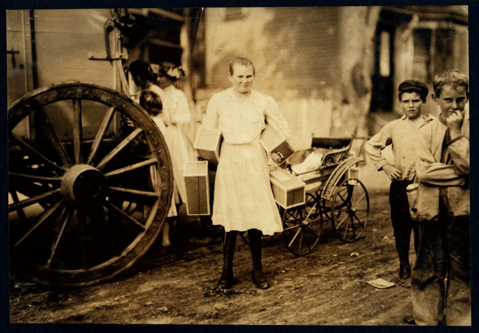 Girl with heavy load of tags. See report. LOC nclc.04233