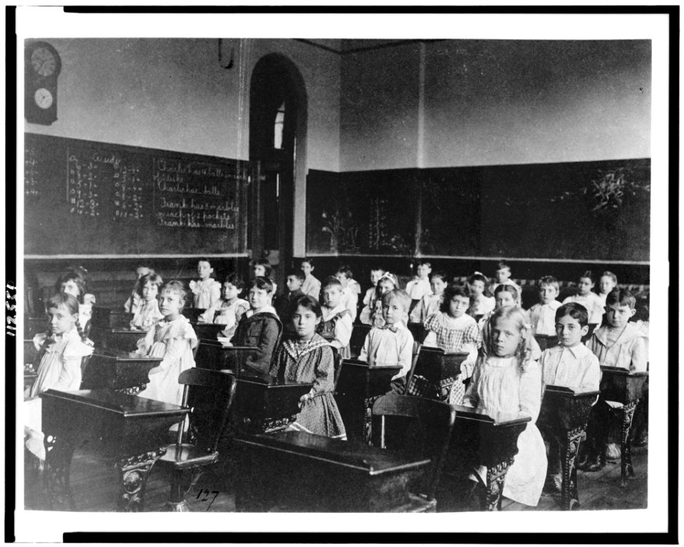 Girls and boys seated at desks in classroom, Washington, D.C. LCCN95500420