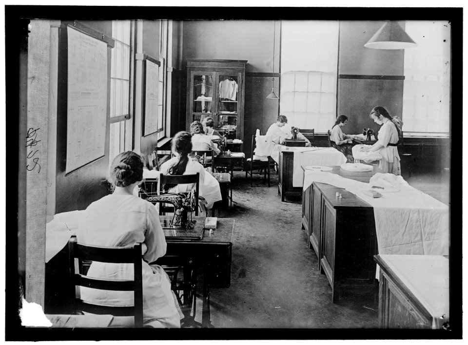 GIRL SCOUTS. WAR SEWING WITH RED CROSS LCCN2016868398
