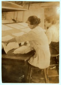 Girls working at mangle in Bonanno Laundry, 12 Foster Wharf. All are 15 years old and go to continuation school. LOC nclc.05199