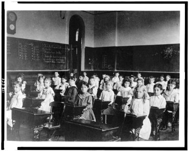 Girls and boys seated at desks in classroom, Washington, D.C. LCCN95500420