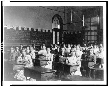 Girls and boys seated at desks in Washington, D.C. classroom LCCN95500425