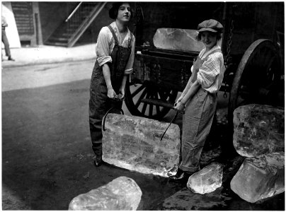 Girls deliver ice. Heavy work that formerly belonged to men only is being done by girls. The ice girls are delivering... - NARA - 533758 photo