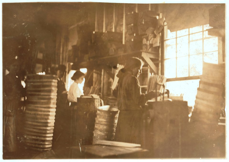 Girls making meat baskets. One probably under fourteen. A basket Factory. LOC nclc.04501