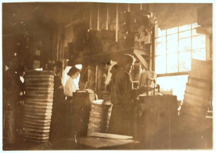 Girls making meat baskets. One probably under fourteen. A basket Factory. LOC nclc.04501