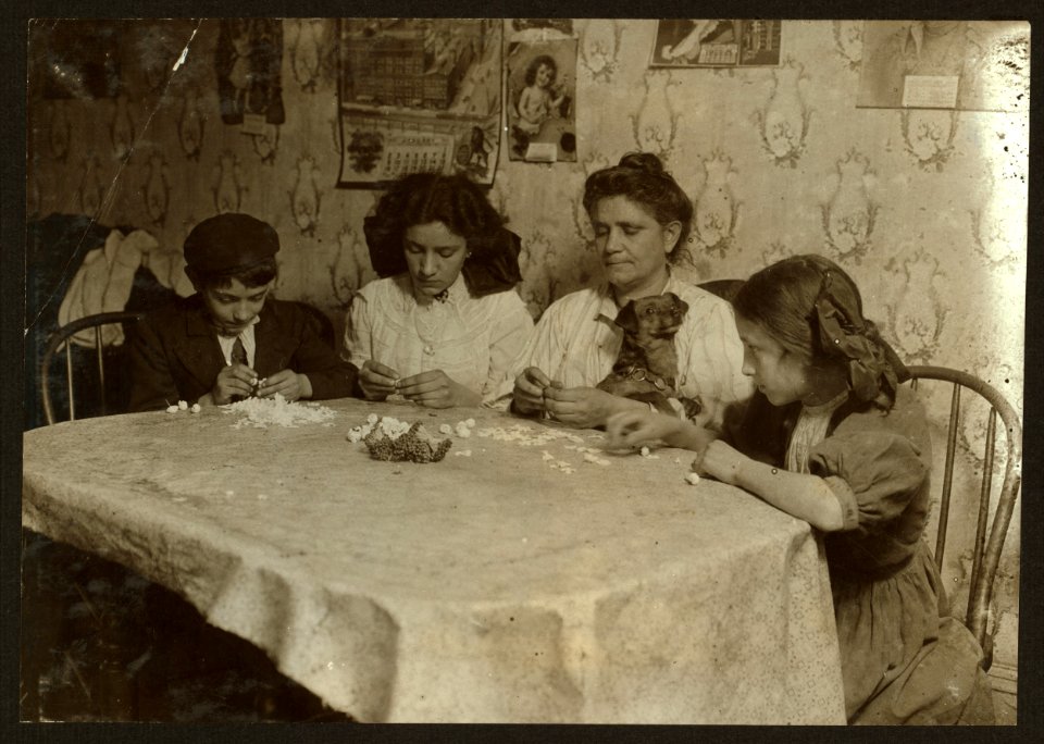 Gizzi family, 175 Sullivan St., 3-30 P.M. Make little roses which are easier than violets, but bring only 9 cents gross. Left to right- Leo, 11 years old. Louise 14 years old. Jose 12 years LOC nclc.04081