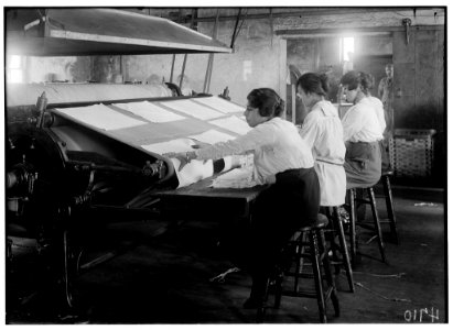 Girls working at mangle in Bonanno Laundry, 12 Foster Wharf. All are 15 years old and go to continuation school. LOC nclc.05620