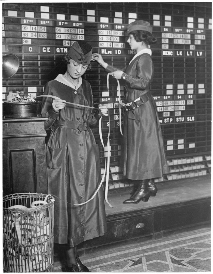 Girls operate stock boards at Waldorf-Astoria. The Waldorf-Astoria Hotel is employing girls to operate tickers and... - NARA - 533759