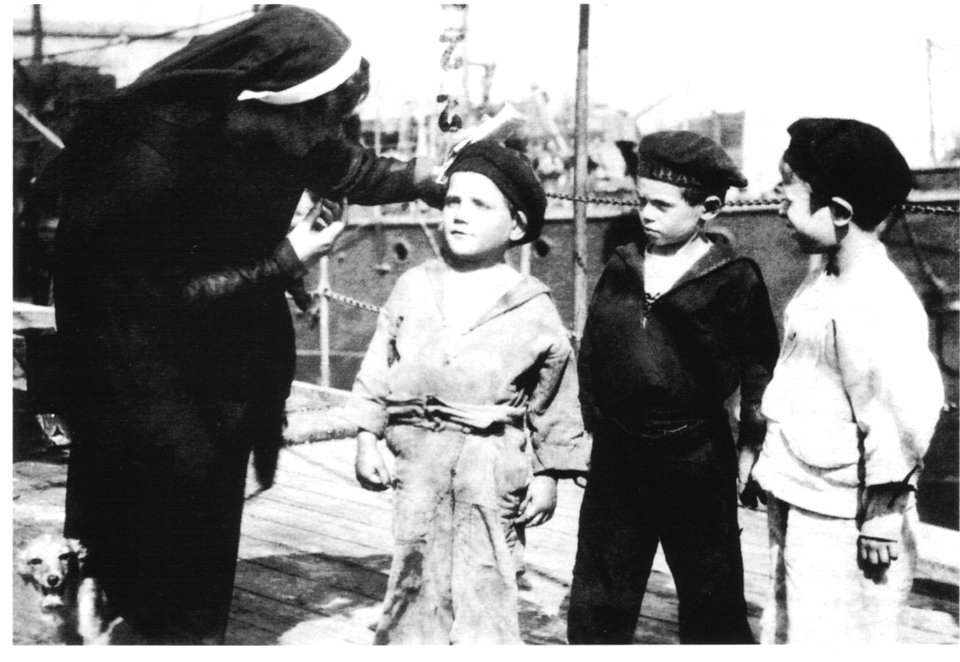 Giulia Civita Franceschi with three boys on the kindergarten ship Caracciolo