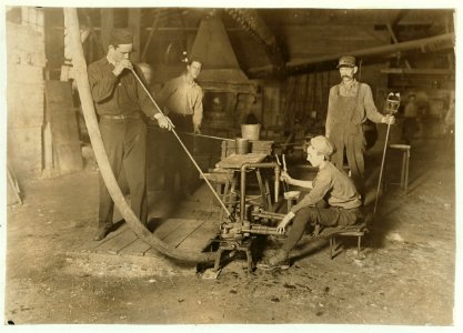 Glass Blower and Mold Boy. Boy has 4 1-2 hours of this at a stretch, then an hour's rest and 4 1-2 more- cramped position. Day shift one week- night shift next. (see label on photo 162.) LOC cph.3a13357