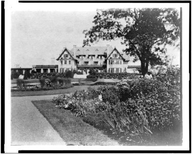 Facade of home of Edmund Cogswell Converse, with flowers in foreground, Greenwich, Connecticut LCCN94502477