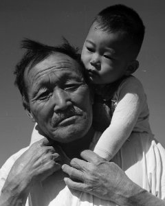 Face detail, Manzanar Relocation Center, Manzanar, California. Grandfather and grandson of Japanese ancestry at . . . - NARA - 537994 (cropped) photo