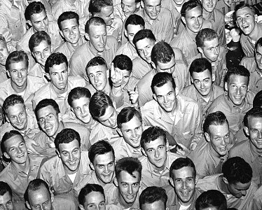 Face detail, Young men training at pre-flight school at Del Monte Hotel, Del Monte, Calif., grin as they file out of the mess hall. - NARA - 520807 (cropped) photo