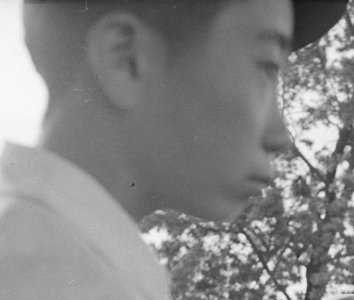 Face detail, Woodland, California. Families of Japanese ancestry with their baggage at railroad station awaiting . . . - NARA - 537803 (cropped) photo