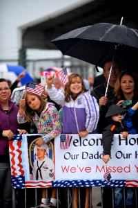 Family and Friends await USS Klakring. (8244611426)