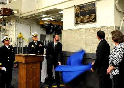 Family members unveil plaque dedicated to retired Cmdr. Michael W. Arnold 141010-N-CC789-038