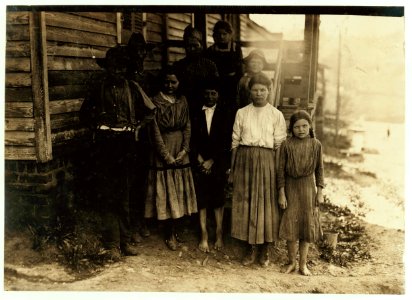Family of J. J. Moore. All but mother and two smallest children on steps work in Washington Cotton Mills, Fries Va. Smallest spinner (right hand end of front row) said she was 14, but she LOC nclc.02127