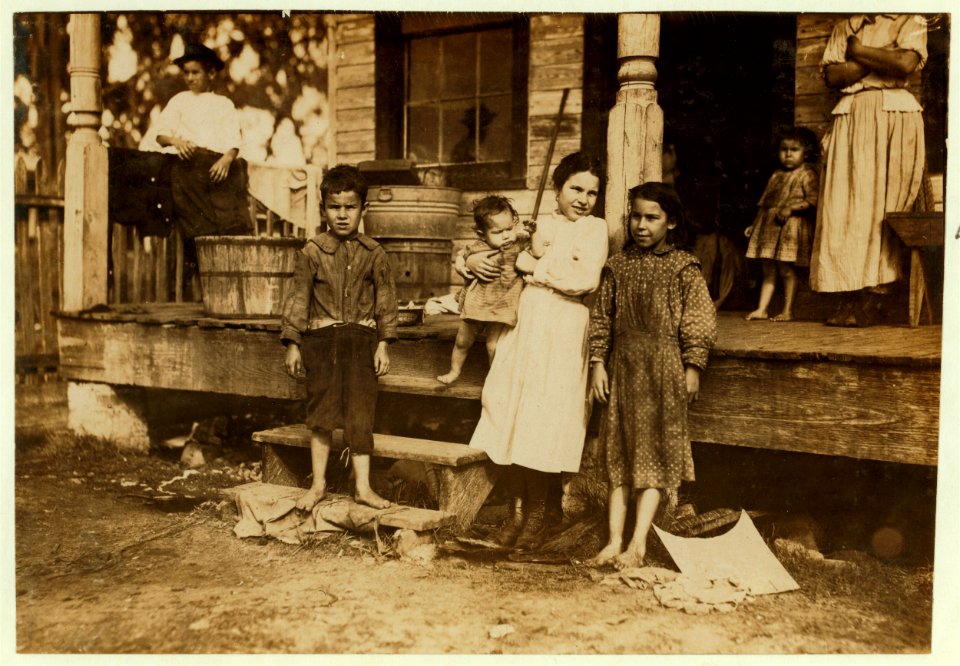 Family of Peter Elvis, New Orleans, La. All except smallest baby work in the Barataria Canning Company. Youngest boy, Jo., seven years old works Saturdays. Alma, the three year-old by the LOC cph.3a01064