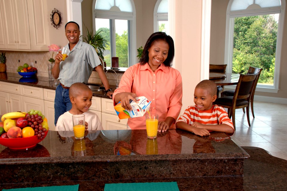 Family drinking juice (1) photo