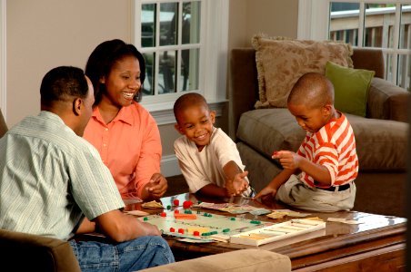Family playing a board game