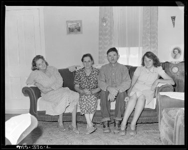 Family of Ricardo Tresso, miner, in living room of their home in company housing project. Calumet Fuel Company... - NARA - 540375