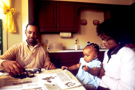 Family sitting at kitchen table