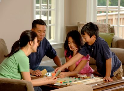 Family playing a board game (3) photo