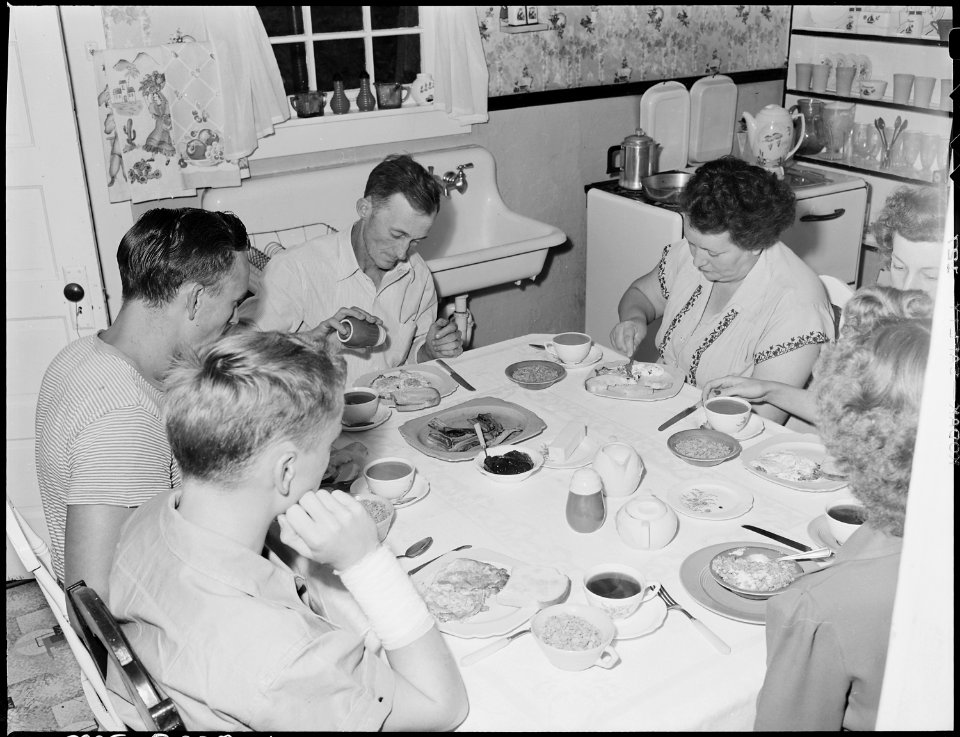 Family of Harry Fain, coal loader, at breakfast. When Mr. Fain works on night shift he has breakfast with the family... - NARA - 541430