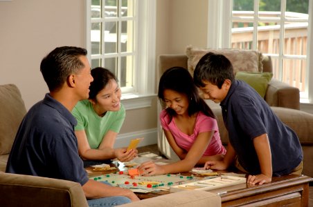 Family playing a board game (2)