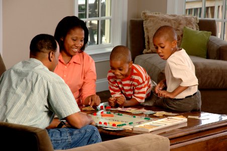 Family playing board game photo