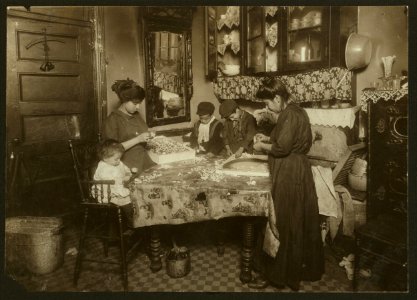 Family of Mrs. Mette making flowers in a very dirty tenement, 302 Mott St, top floor. Josephine, 13 yrs. old, helps out side school hours until 9 P.M. sometimes. She is soon to be 14 and LOC cph.3b45427