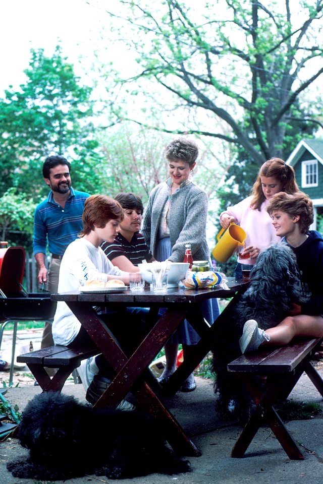 Family seated at picnic table