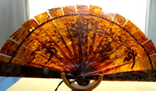 Fan, tortoiseshall with gold leaf and silver encrustations - Fan Room, Alcázar of Seville, Spain - DSC07327 photo