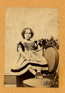 Fannie Virginia Casseopia Lawrence, full-length portrait, seated, with feet on chair, facing front LCCN99403033