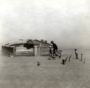 Farmer walking in dust storm Cimarron County Oklahoma3