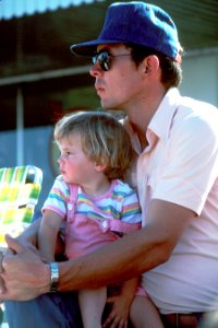 Father holding daughter