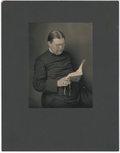 Father William Harman van Allen reading a book LCCN2015647687