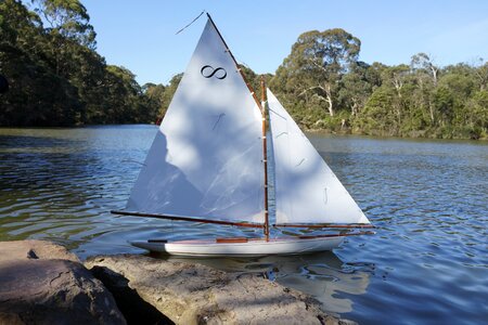 Placid lake leisure sailboat photo
