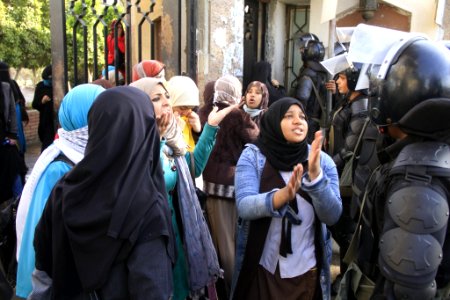 Female Islamist students and police - protest at Al-Azhar University Cairo 11-Dec2013