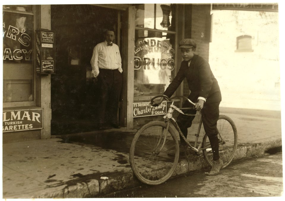 Fifteen year old delivery boy for Linders Drug Store, which is located on the edge of the Reservation, Griffin St. The boy has just returned from a trip to one of these houses. He works from LOC nclc.03902